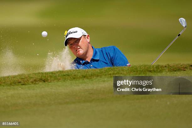 Jarrod Lyle chips out of a bunker on the third hole during the final round of the Mayakoba Golf Classic on March 1, 2009 at El Camaleon Golf Club in...