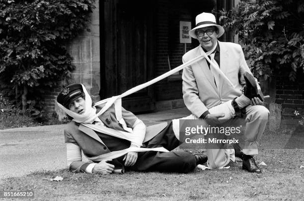 Eric Morecambe and Tom Baker on location at Hever Castle, where they are making a comedy film, 18th August 1982.