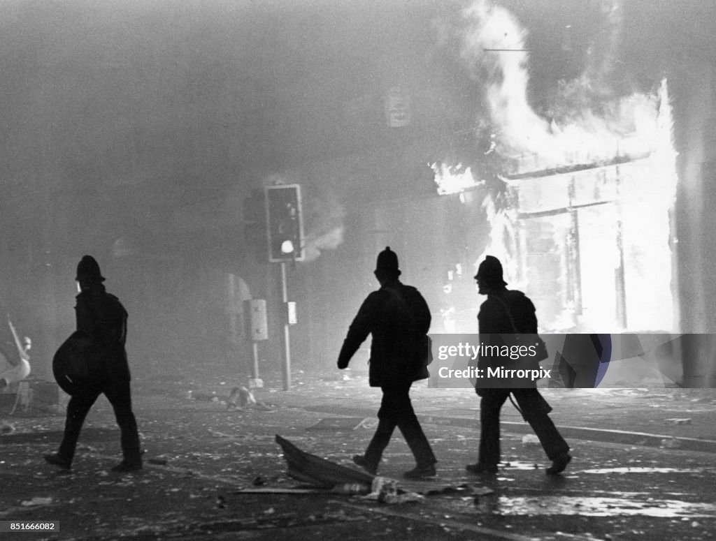 Toxteth Riots Reporter Police officers in riot gear outside a burning looted shop in Park ...