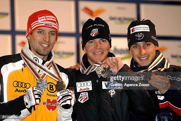 Second placed Bjoern Kircheisen of Germany, winner Bill Demong of USA and third placed Jason Lamy Chappuis of France pose with their medals on the...