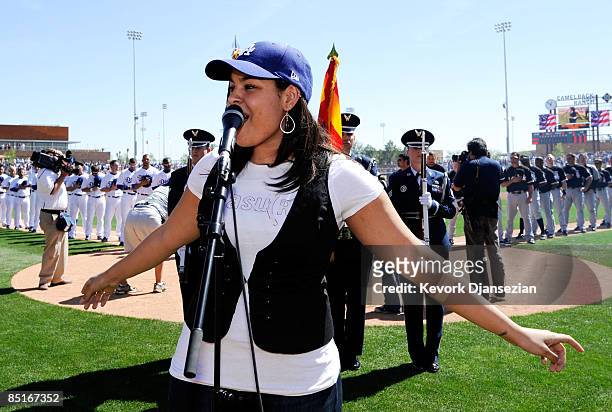 Jordin Sparks sings the national anthem during pre-game ceremonies for the Los Angeles Dodgers home opener against the Chicago Whites Sox at...