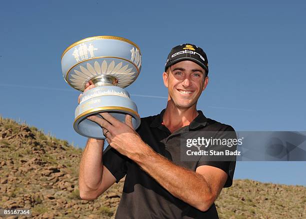 Geoff Ogilvy holds the Walter Hagen Cup trophy after winning the final round of the World Golf Championships-Accenture Match Play Championship held...