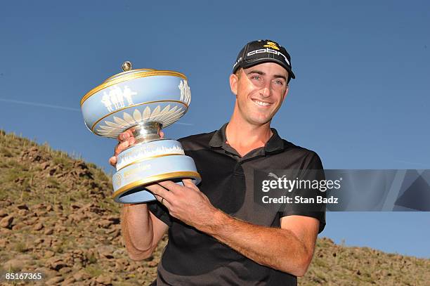 Geoff Ogilvy holds the Walter Hagen Cup trophy after winning the final round of the World Golf Championships-Accenture Match Play Championship held...