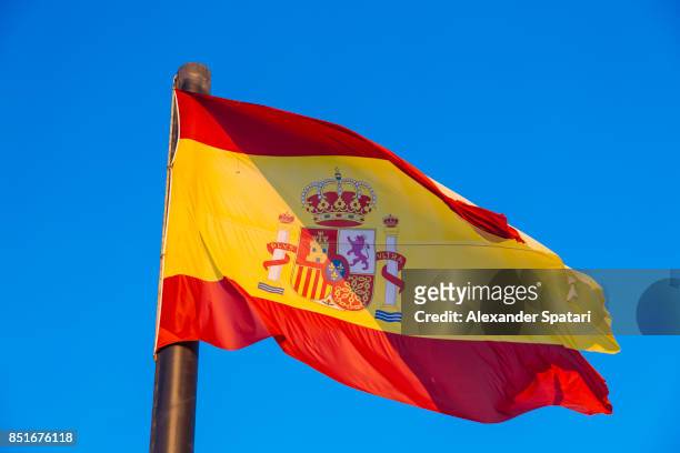 national flag of spain waving in the wind - spain flag stock pictures, royalty-free photos & images