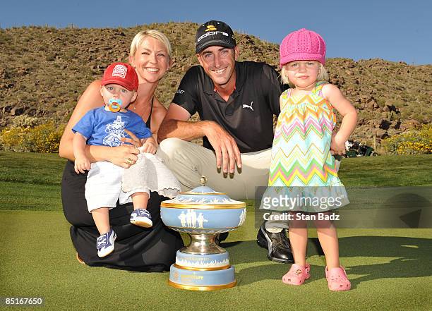 Geoff Ogilvy and family members wife Juli, son, Jasper, and daughter, Phobe, posed with the Walter Hagen Cup trophy after winning the final round of...