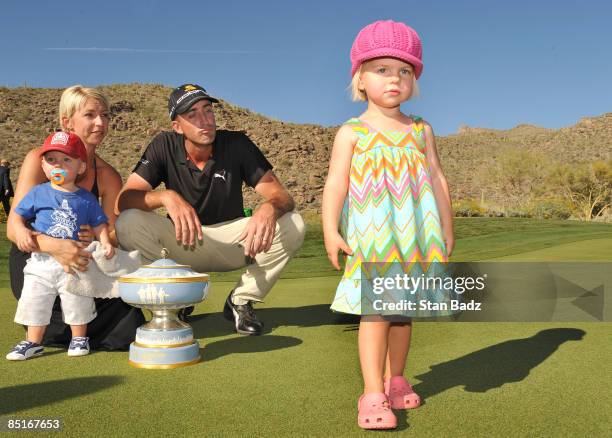 Geoff Ogilvy and family members wife Juli, son, Jasper, watch their daughter, Phobe, exit early during the trophy ceremony with the Walter Hagen Cup...