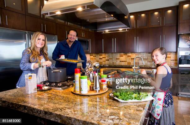 Magician Penn Jillette, wife Emily and daughter Moxie are photographed for Closer Weekly Magazine on June 15, 2016 at home in Nevada.