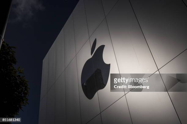 The Apple Inc. Logo is seen on the front of the store during the sales launch of the Apple Inc. IPhone 8 smartphone, Apple watch series 3 device, and...