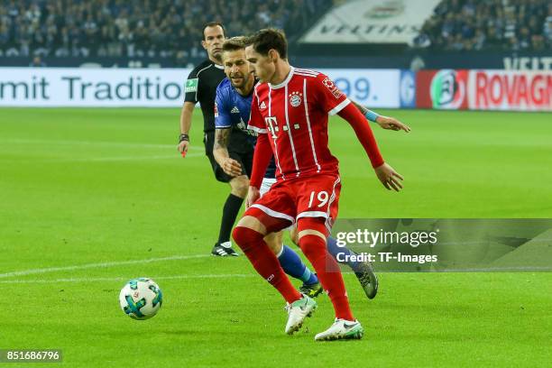 Sebastian Rudy of Bayern Muenchen and Guido Burgstaller of Schalke battle for the ball during the Bundesliga match between FC Schalke 04 and FC...