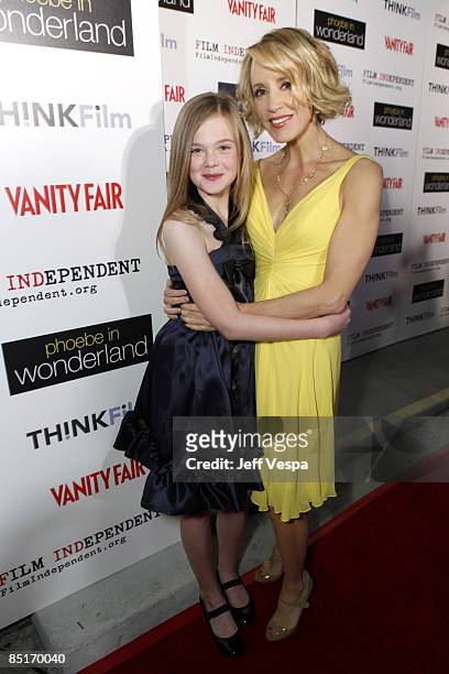 Actresses Elle Fanning and Felicity Huffman arrive to the Film Independant screening of "Phoebe In Wonderland" held at the WGA Theatre on March 1,...