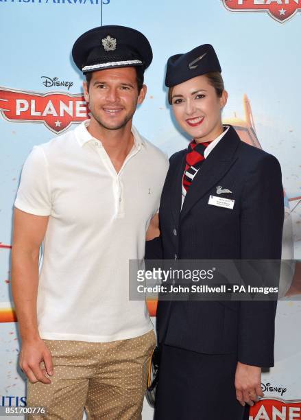 West Ham United's Matt Jarvis poses with Victoria Boyce of British Airways as he arrive for the screening of Disney studios film 'Planes' at the...