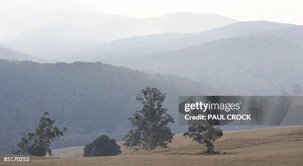 Smoke lingers over the mountains near Neerim South from the Bunyip Ridge Fire which continues to burn within containment lines in the Bunyip State...