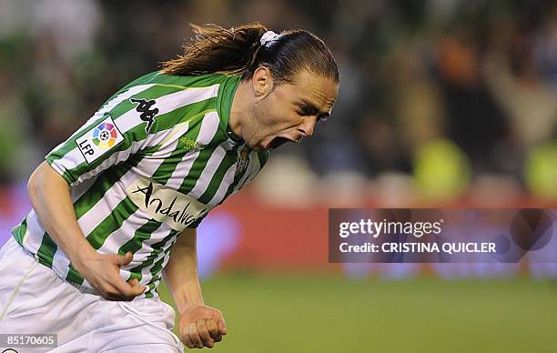 Betis's Sergio Garcia celebrates after scoring against Villarreal during their Spanish league football match at Ruiz de Lopera stadium in Seville on...