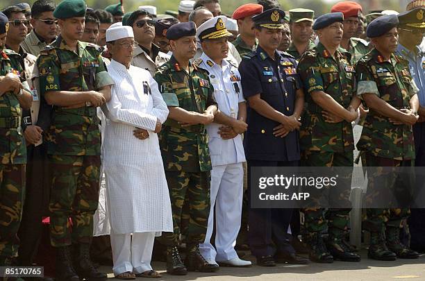 Bangladeshi President Zillur Rahman and Bangladesh Army chief General Moeen U Ahmed perform prayers during a funeral for fallen officers, killed...
