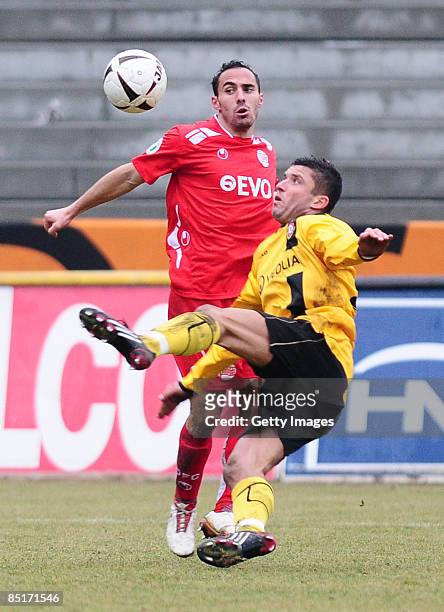 Fouad Brighache of Kickers Offenbach and Pavel Dobry of Dynamo Dresden battle for the ball during the 3. Liga match between Dynamo Dresden and...