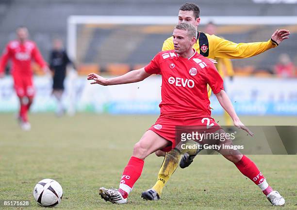 Alexander Huber of Kickers Offenbach and Thomas Broeker of Dynamo Dresden battle for the ball during the 3. Liga match between Dynamo Dresden and...
