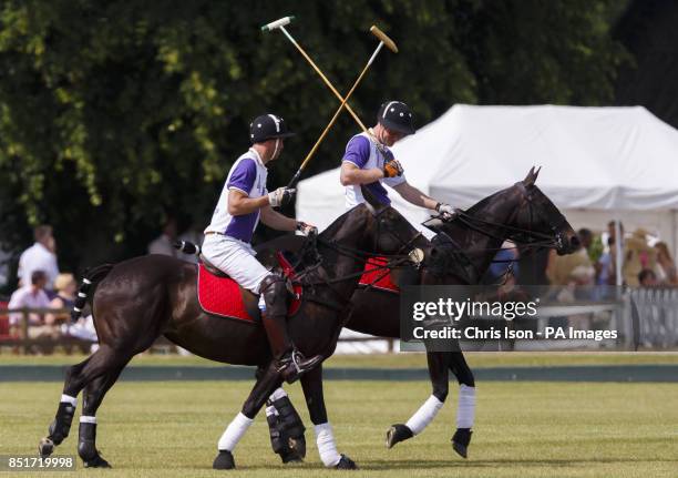 The Duke of Cambridge and Prince Harry in action during The Jerudong Trophy at Cirencester Park Polo Club in Cirencester, Gloucestershire.