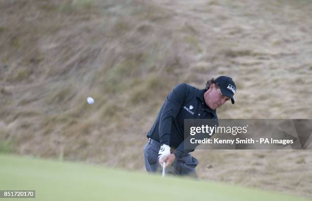 Phil Mickelson chips from the back of the 18th during the play off hole close to give him birdie and the championship during day four of the Aberdeen...