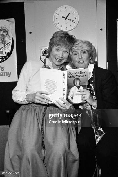 Shirley MacLaine at the BBC to appear on the Gloria Hunniford programme with her new book 'Out on a Limb', Shirley and Gloria posing with the book,...