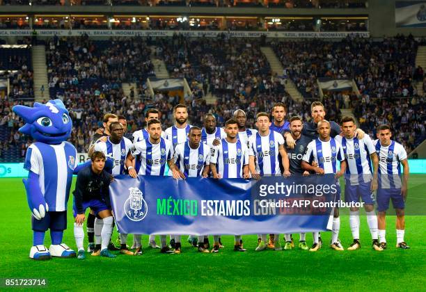 Porto team pose holding a banner reading "Mexico, we are with you" before the Portuguese league football match FC Porto vs Portimonense at the Dragao...