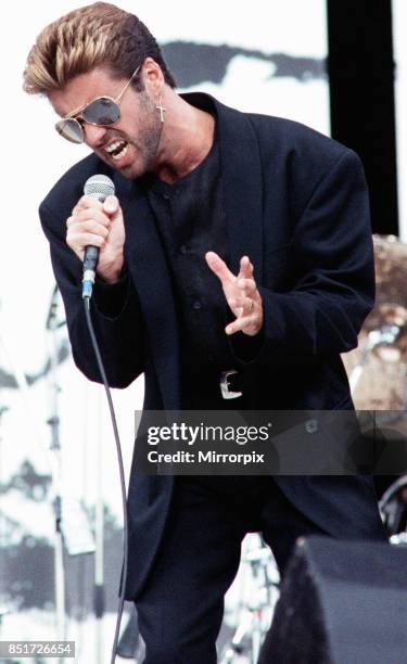 George Michael performing on stage at the Nelson Mandela 70th Birthday Tribute concert also known as the Free Nelson Mandela Concert at Wembley, 11th...