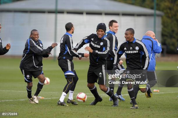 Didier Drogba , Salomon Kalou and Mineiro of Chelsea during a training session at the training ground on March 02, 2009 in Cobham, United Kingdom