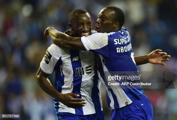 Porto's Malian forward Moussa Marega is congratulated by teammate Cameroonian forward Vincent Aboubakar after scoring a goal during the Portuguese...