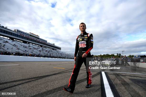 Kasey Kahne, driver of the Road to Race Day Chevrolet, walks on the grid during qualifying for the Monster Energy NASCAR Cup Series ISM Connect 300...