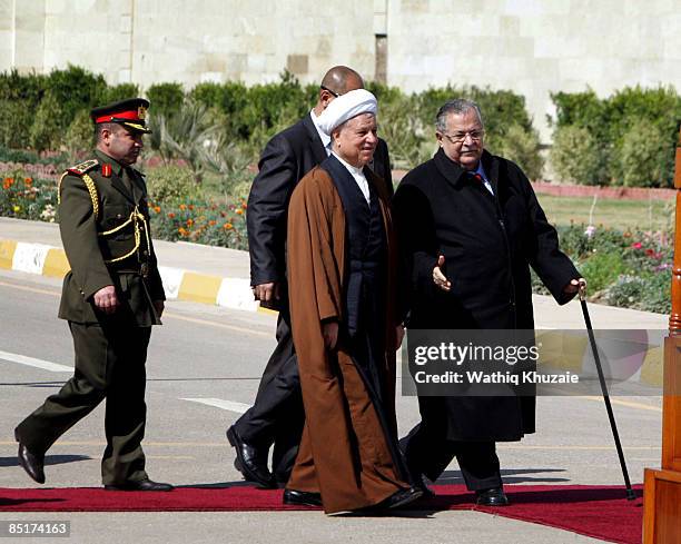 Iraqi President Jalal Talabani and Former Iranian President Akbar Hashemi Rafsanjani walk together during a welcoming ceremony on March 2, 2009 at...