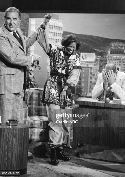 Pictured: Ed McMahon raises singer Dionne Warwick's hand during an interview with guest host McLean Stevenson on October 18, 1976 --