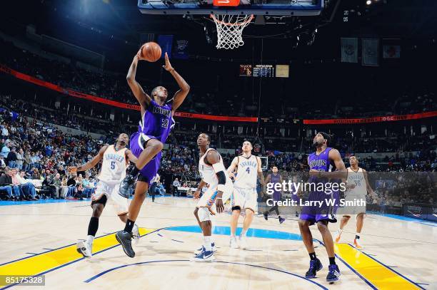 Jason Thompson of the Sacramento Kings puts up a shot around Kyle Weaver of the Oklahoma City Thunder during the game on February 8, 2009 at the Ford...