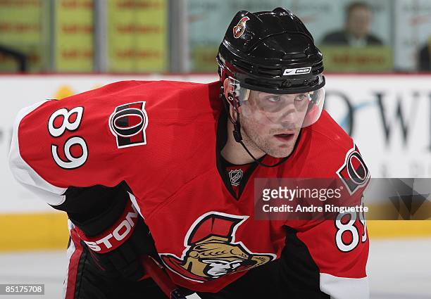 Mike Comrie of the Ottawa Senators prepares for a faceoff against the San Jose Sharks at Scotiabank Place on February 26, 2009 in Ottawa, Ontario,...