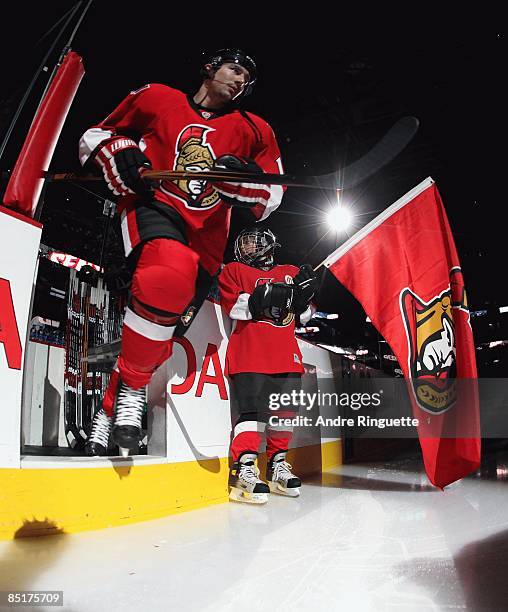 Chris Campoli of the Ottawa Senators steps onto the ice during player introductions prior to a game against the San Jose Sharks at Scotiabank Place...