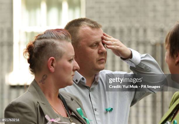 Shirley and Michael Anderson, the parents of Jade Anderson who was mauled to death by dogs with Julie Hilling, MP for Bolton West, after handing in a...