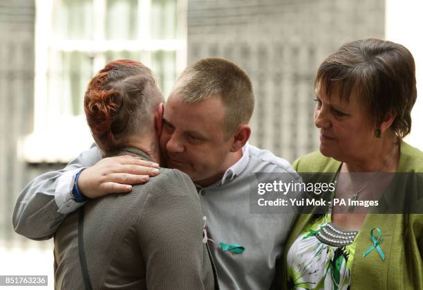 Shirley and Michael Anderson, the parents of Jade Anderson who was mauled to death by dogs , with Julie Hilling, MP for Bolton West, after handing in...