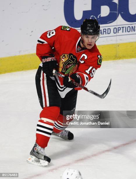 Jonathan Toews of the Chicago Blackhawks follows through after passing the puck against the Los Angeles Kings on March 1, 2009 at the United Center...