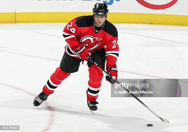 Bryce Salvador of the New Jersey Devils plays the puck against the Florida Panthers at the Prudential Center on February 28, 2009 in Newark, New...