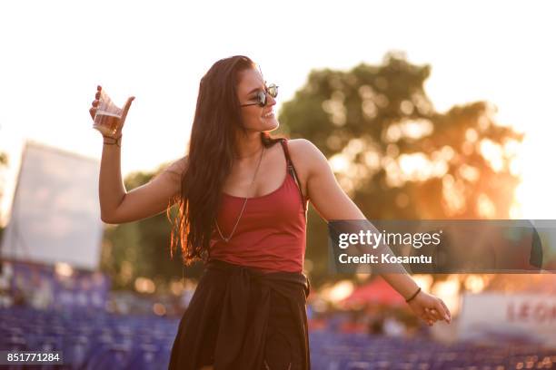 happy brunette girl dancing outdoors - festival day 1 stock pictures, royalty-free photos & images