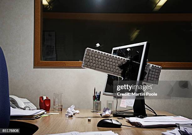 computer keyboard smashed through screen - frustration stock pictures, royalty-free photos & images