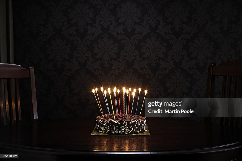 Birthday cake on table in living room