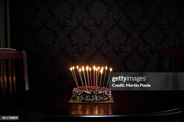 birthday cake on table in living room - birthday candle stock pictures, royalty-free photos & images