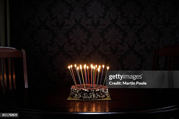 birthday cake on table in living room - birthday cake stock pictures, royalty-free photos & images