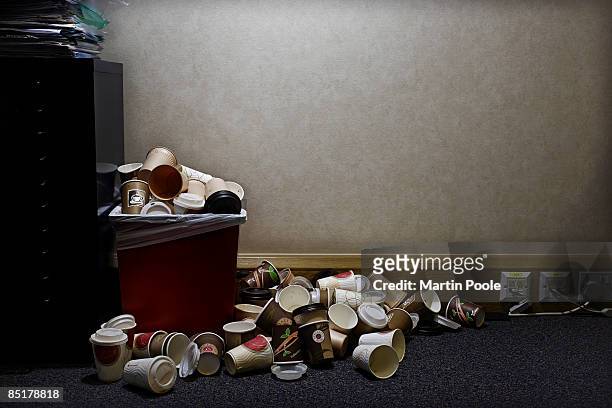 pile of coffe cups in corner of office - feeling full stock pictures, royalty-free photos & images