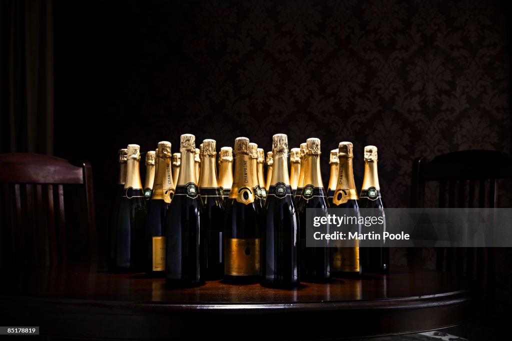 Loads of champange bottles on living room table