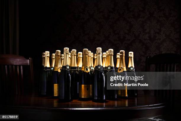 loads of champange bottles on living room  table - champagne ストックフォトと画像