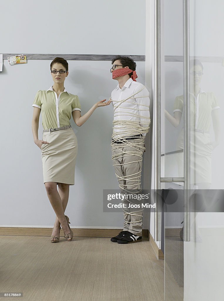 Office Worker Tied Up With Ropes In Corner High-Res Stock Photo - Getty ...