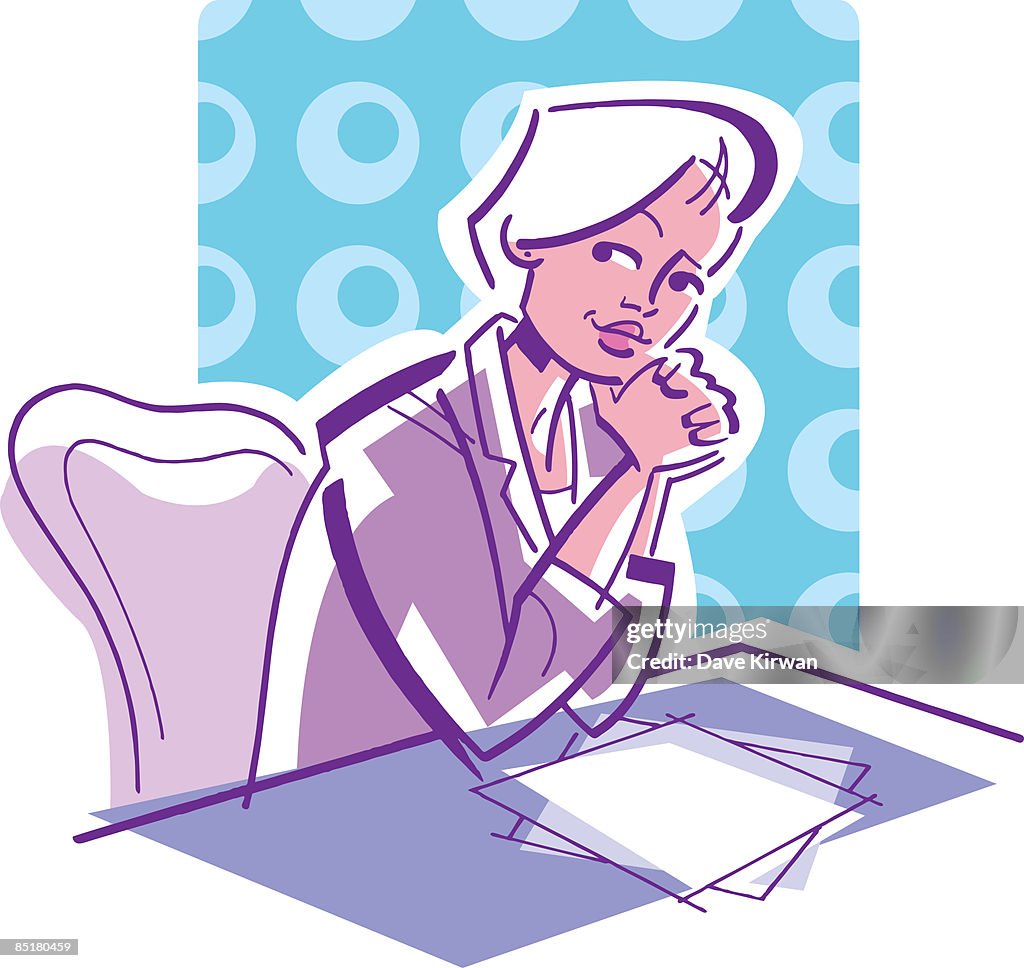 A woman sitting at her desk in the office