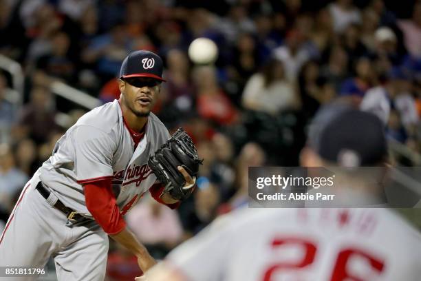 Edwin Jackson of the Washington Nationals throws to Adam Lind of the Washington Nationals to try to pick off Amed Rosario of the New York Mets at...