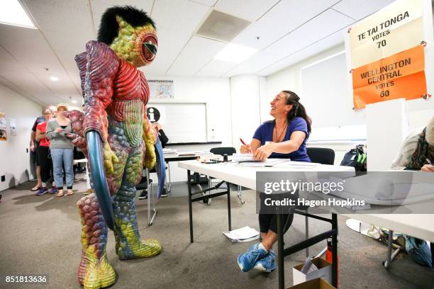 Dylan Nicholson, dressed in World of WearableArt garment 'Watcher in the Water' by Craig McMillan of New Zealand, prepares to vote at Wellington City...