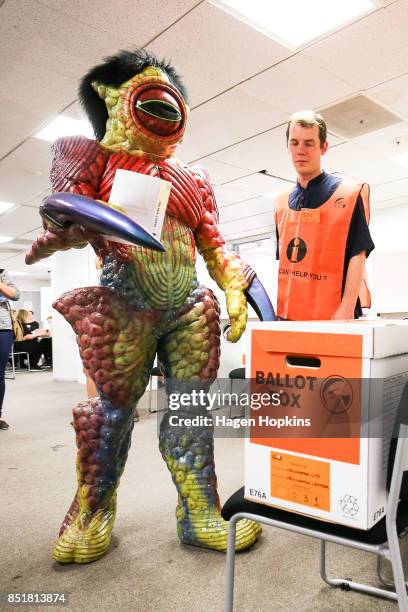 Dylan Nicholson, dressed in World of WearableArt garment 'Watcher in the Water' by Craig McMillan of New Zealand, votes at Wellington City Library on...